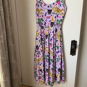 Nooworks vacation dress in purple with pockets and whimsy print